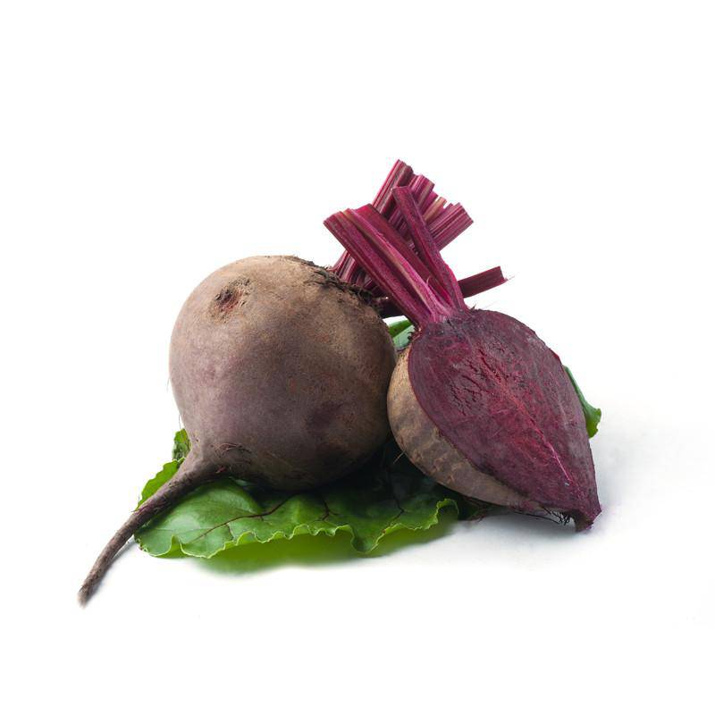 Beets and greens on white background.