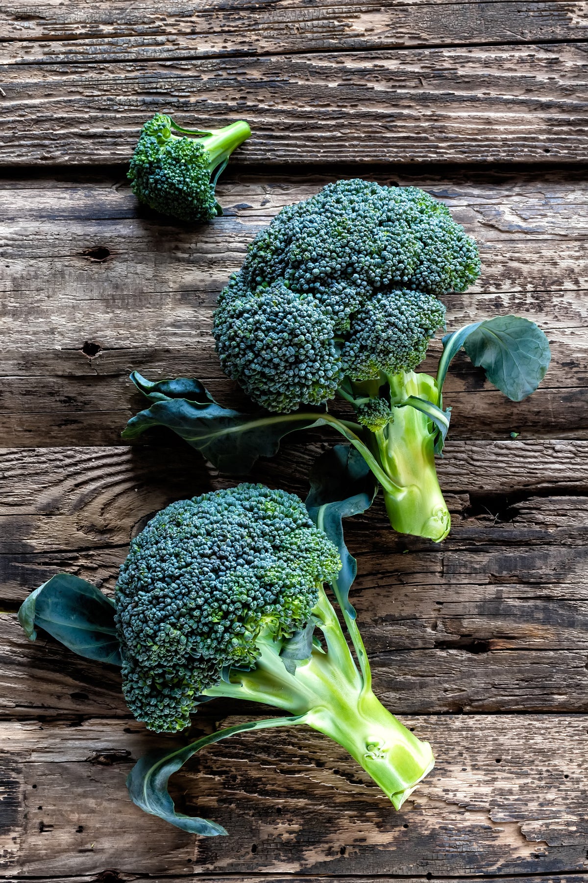 Broccoli on a rustic wooden table.