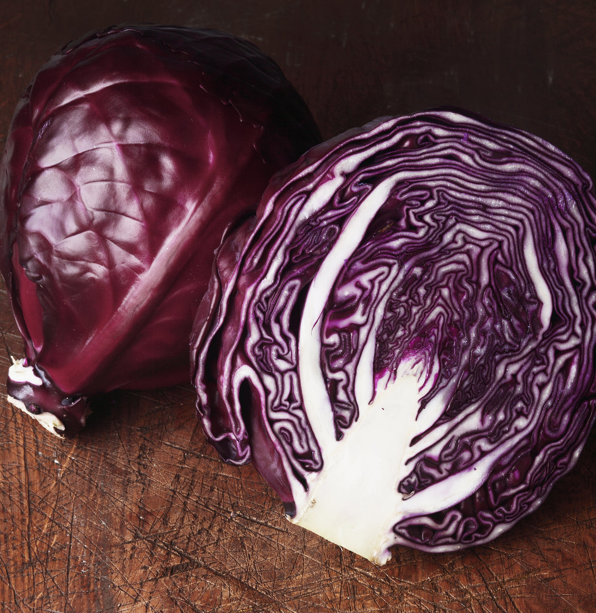 Sliced Red cabbage on a rustic wooden table.