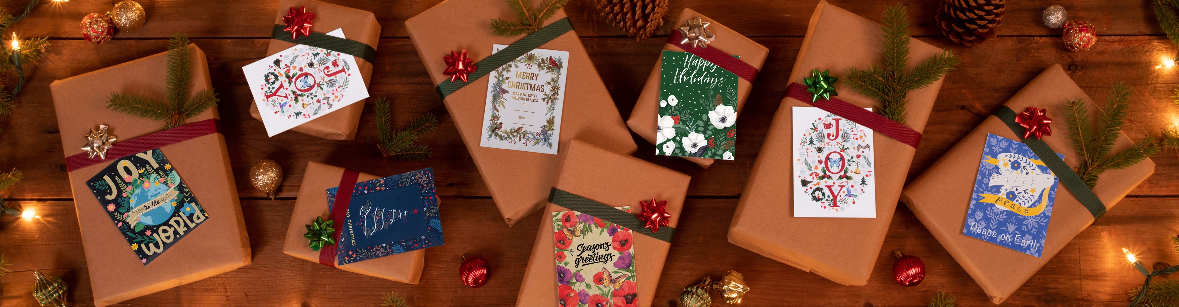 Gift boxes with decorative labels on a wooden surface