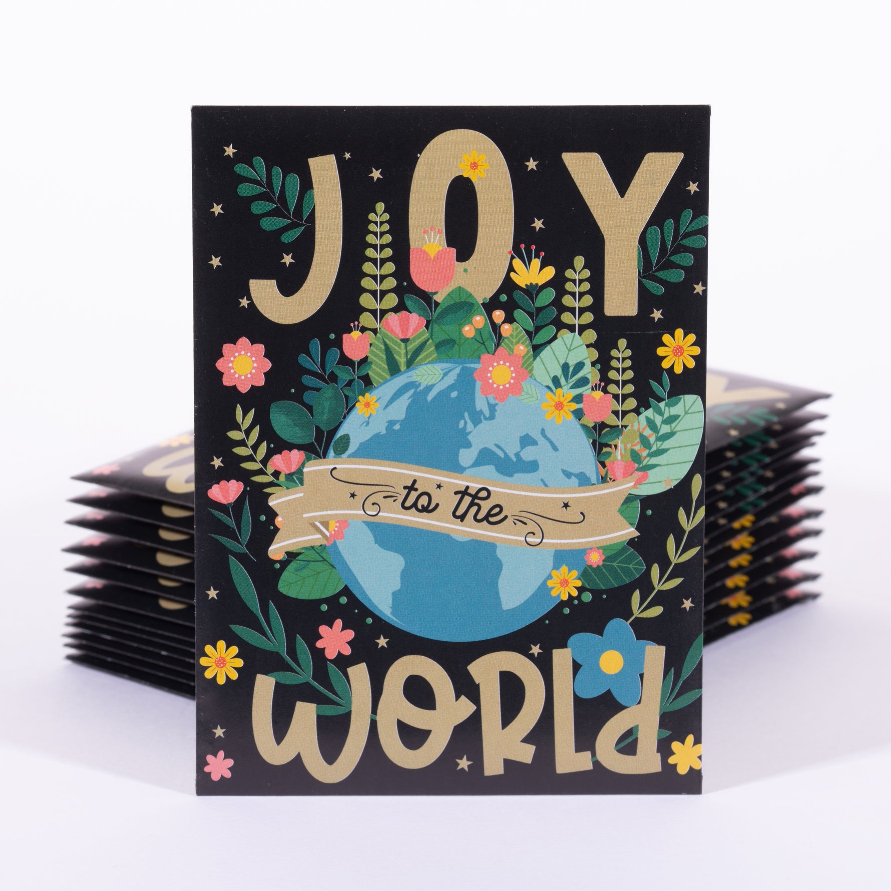 Greeting card seed packet with 'Joy to the World' text and Earth illustration on a black background