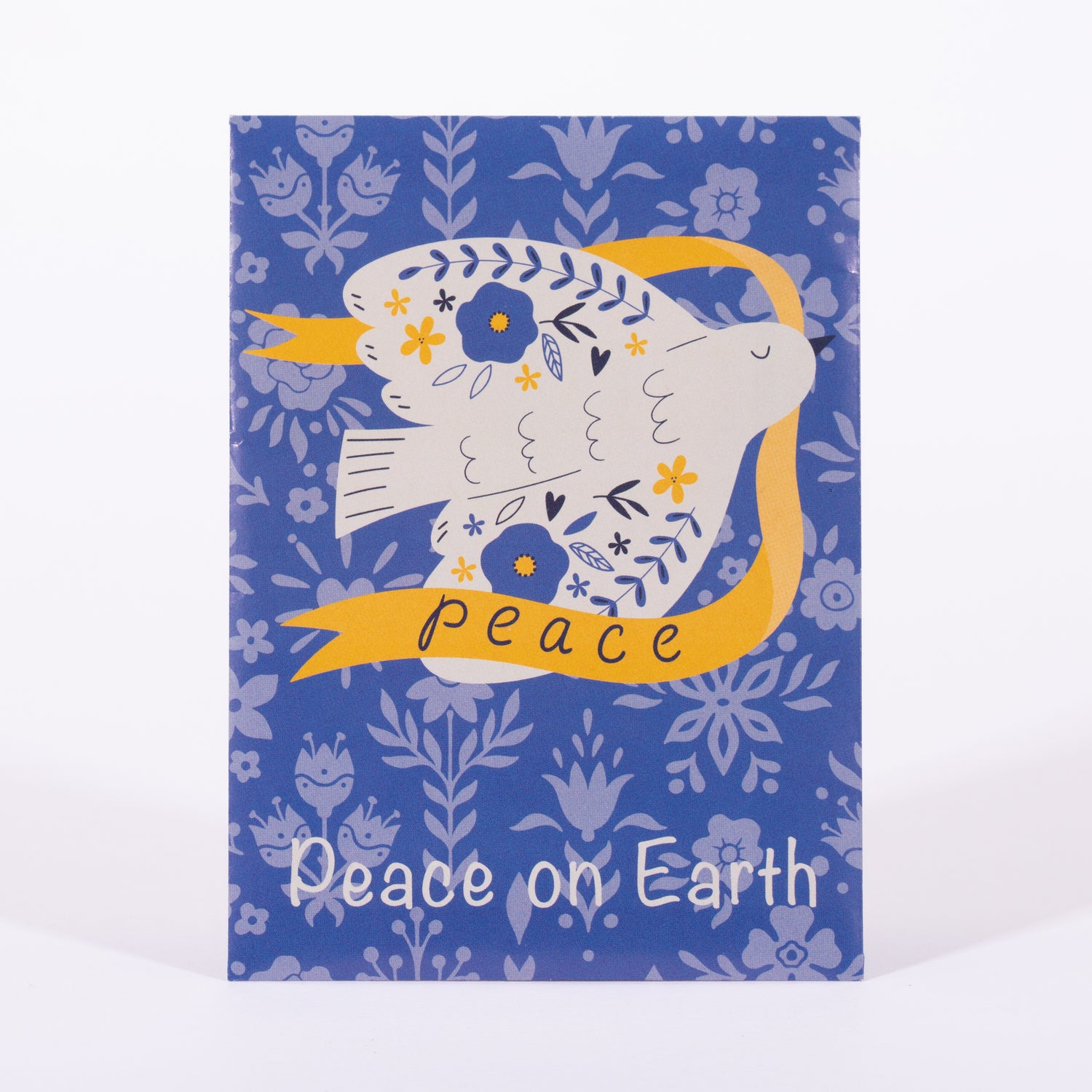 Seed packet card with a dove holding a 'Peace' banner on a blue floral patterned background