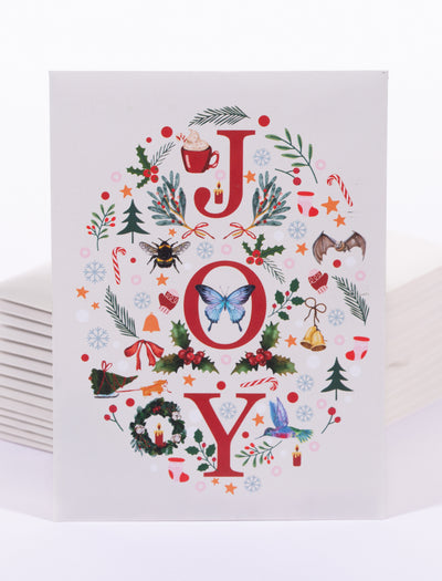 Set of 25 Christmas-themed cards with decorative 'JOY' text on a white background
